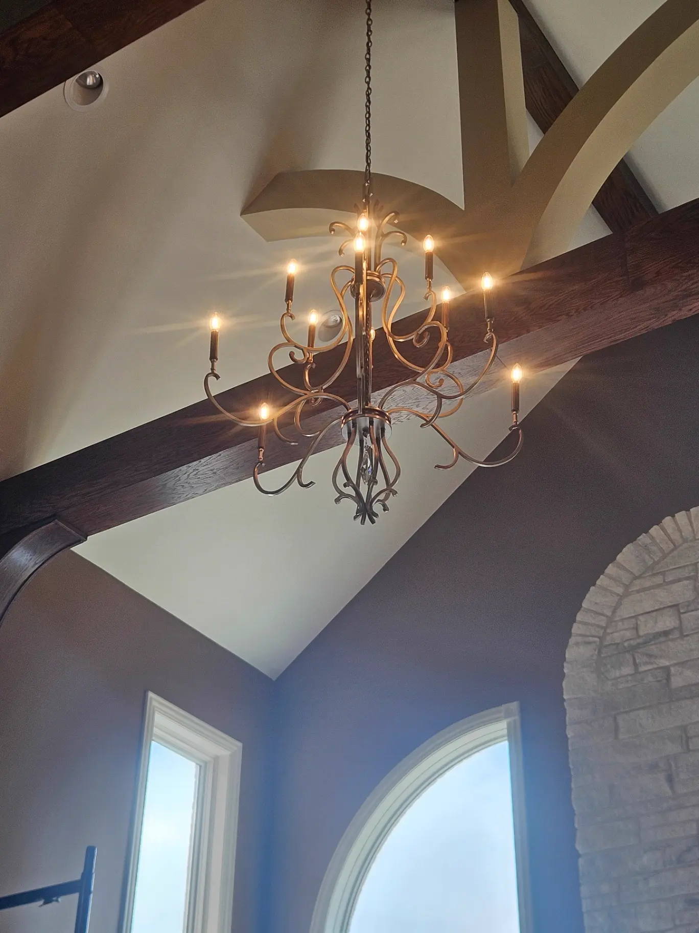 Custom chandelier installed in vaulted ceiling